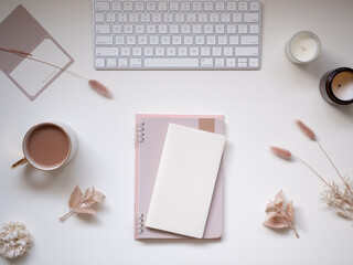 Pink and beige feminine workspace, pastel toned computer desk flat lay top view	