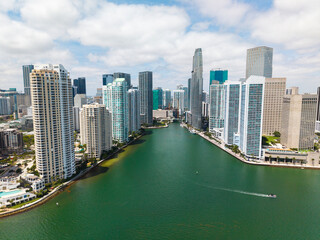 Aerial view of Brickell skyline in downtown Miami. Modern skyscrapers rise above Biscayne Bay....