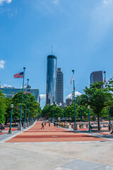 Nature framed the city, trees bowing toward the tower of glass, Centennial Olympic Park, Atlanta,...