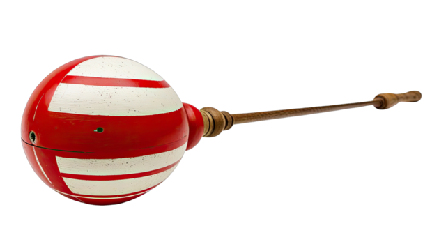 A round, red and white striped ball affixed to a long wooden handle