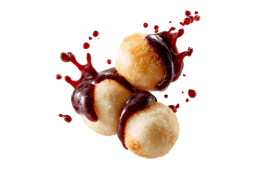 Fried dough balls with berry sauce splash floating in the air isolated on transparent background