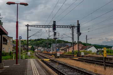 Railway tracks and platform leading to a residential area