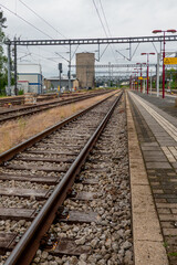 Railway tracks and platform leading to industrial area
