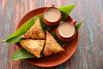 Samosa crunchy triangular shaped wraps stuffed with spicy vegetables. Cocktail mini triangle Kerala...