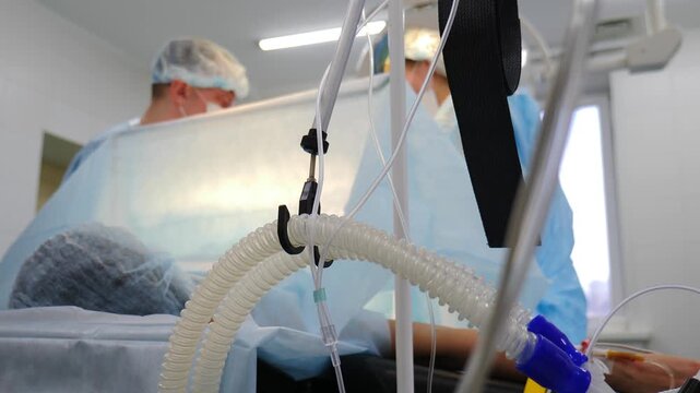 Childbirth by caesarean section. doctors surgeon performing incision on patient abdomen stomach in hospital clinic. Surgery and hospital concept. maternity care, medical procedure. 4 k video