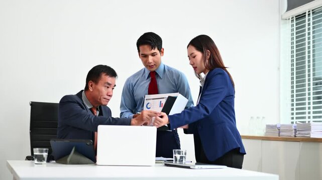 Business team discuss at meeting room. working together with laptop ,tablet and smart phone on desk Financial accountant , planner , meeting , introduction concept. At office