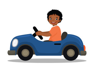 Little African boy driving toy car side view
