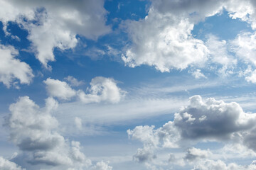 Blue sky with scattered cumulus clouds