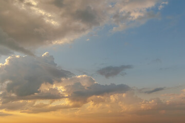 Dramatic sunset sky with golden clouds
