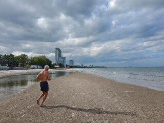 A man jogging on Hua Hin beach
