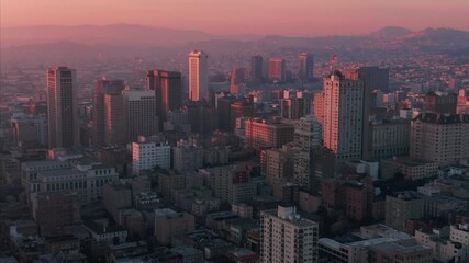 San Francisco, USA: An aerial view of the city skyline at sunrise, showcasing the urban landscape and architecture bathed in the warm, soft light of dawn. - Powered by Adobe