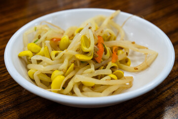 seasoned bean sprouts. a traditional Korean side dish, called Kongnamul muchim