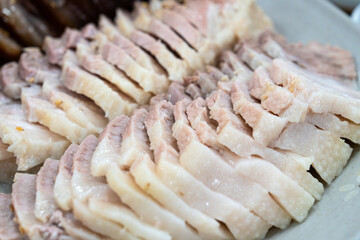 bossam. Bossam is a popular Korean dish made from boiled pork belly, thinly sliced and served with various side dishes like spicy radish salad and kimchi.
