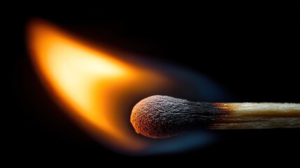 A close-up view of a burning match, showcasing the vibrant orange flame against a dark background.