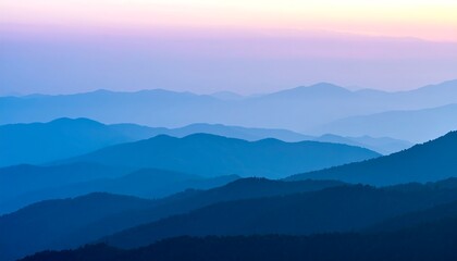 Fototapeta premium Misty mountain range at sunrise