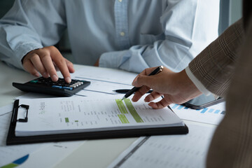 Businessman and businesswoman working together in an office