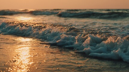 Ocean waves at sunset golden light reflection