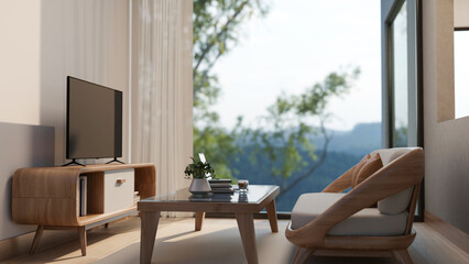 Television and sofa with glass top wooden table in living room with window wall and mountain scenery