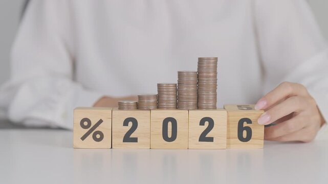 2026 New year with percentage change to UP and Down arrow with coin stack. Interest rate, GDP, stocks market, financial, deflation and Inflation, mortgage, debt, Loan and Economic Recession