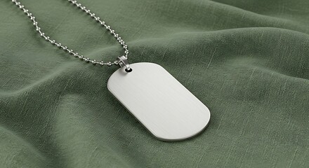 A blank, brushed-metal dog tag on a silver ball chain necklace