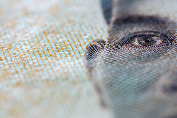 Close-Up View of Detailed Currency Design Featuring Human Face