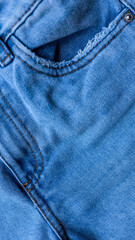 Fototapeta premium Close-up of blue denim jeans pocket
