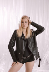 Portrait of a very beautiful blonde woman in a leather jacket.