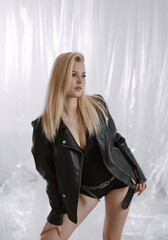 Portrait of a very beautiful blonde woman in a leather jacket.