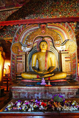 Exquisite Seated Buddha statue with a Makara thorana arch,Cave 3, the Maha Alut Viharaya at the Dambulla Cave temples built 1st centure BCE by King Valagamba and Lankan kings in Dambulla,Sri Lanka
