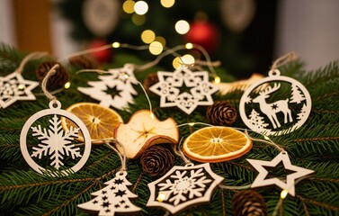 Golden baubles and red ribbons on a pine tree branch, glowing with sparkling lights, cozy festive ambiance for Christmas Day