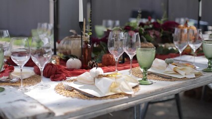 Slider shot of a fall themed outdoor dinner.