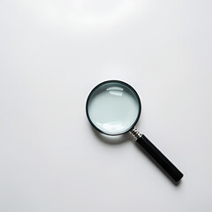 Magnifying glass on a clean desk background