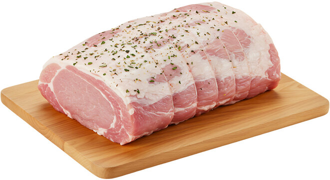 Fresh pork loin roast seasoned with herbs on a wooden cutting board isolated on transparent background, ready for cooking a delicious meal
