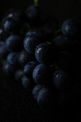 Fresh black grapes close up, organic fruit, healthy food