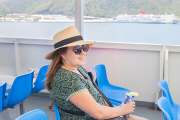 Woman relaxing on cruise ship deck with sea view