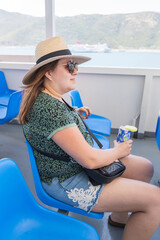 Woman relaxing on cruise ship deck with sea view