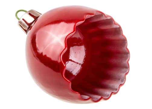 Shiny red Christmas ornament with scalloped edge isolated on a transparent background