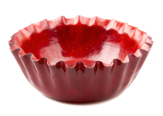 Shiny red fluted baking cup with dark background isolated on a transparent background
