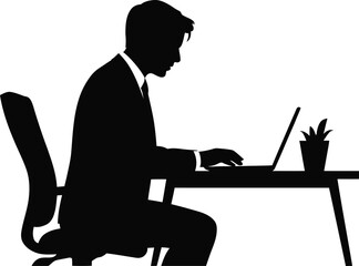 Silhouette of business man working on laptop at his desk