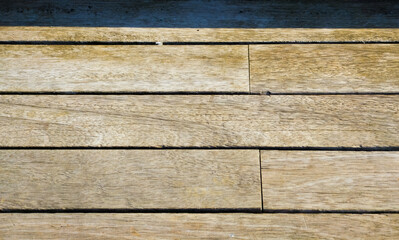 Obraz premium Weathered wooden decking with horizontal planks and natural texture