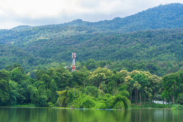 a public place leisure travel landscape lake views at Ang Kaew Chiang Mai University and Doi Suthep nature forest Mountain views spring cloudy sky background with white cloud.
