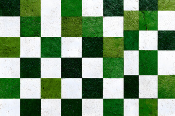 a green and white checkered tile wall