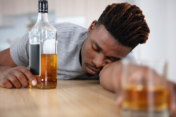 alcohol addicted man sleeping at the table