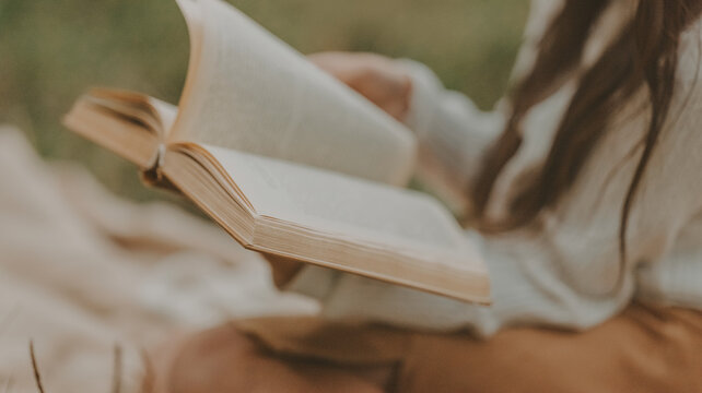 Reading a book outdoors