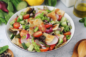 A bowl with Fattoush - Traditional Levantine salad