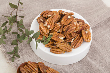 Many pecan nuts isolated on white, set