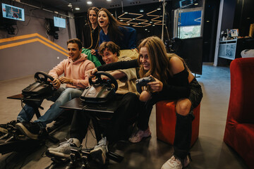 Friends gathered together, engaged in an intense and fun gaming activity, fostering friendship and enjoyment through friendly competition and shared experiences in a dynamic social environment.