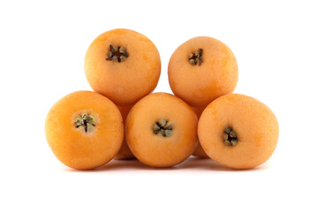 A collection of fresh loquats, showcasing their warm orange tones and natural texture.
