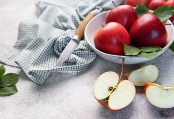 Fresh red apples in bowl with knife