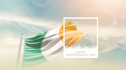 Ireland flag waving proudly under a bright sky with text happy independence day. Ireland national...